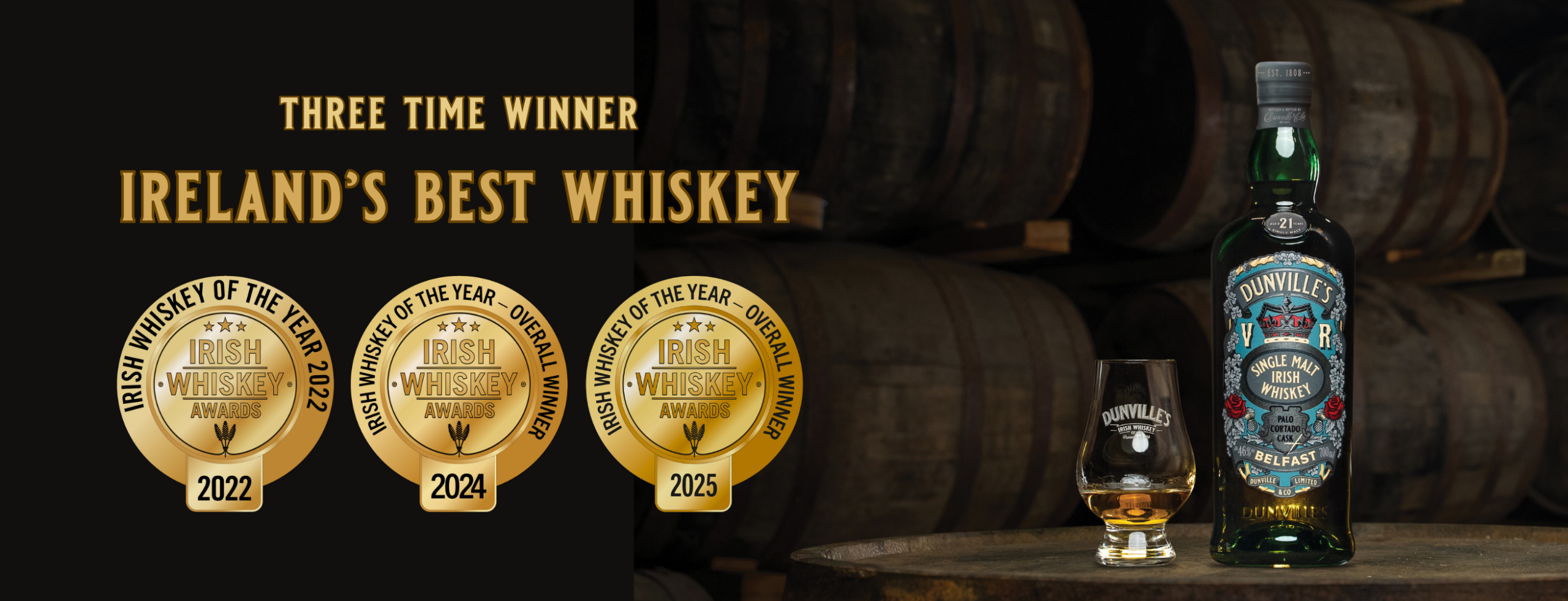 Bottle of Dunville's Irish Whiskey with three IReland's Best Whiskey award medals